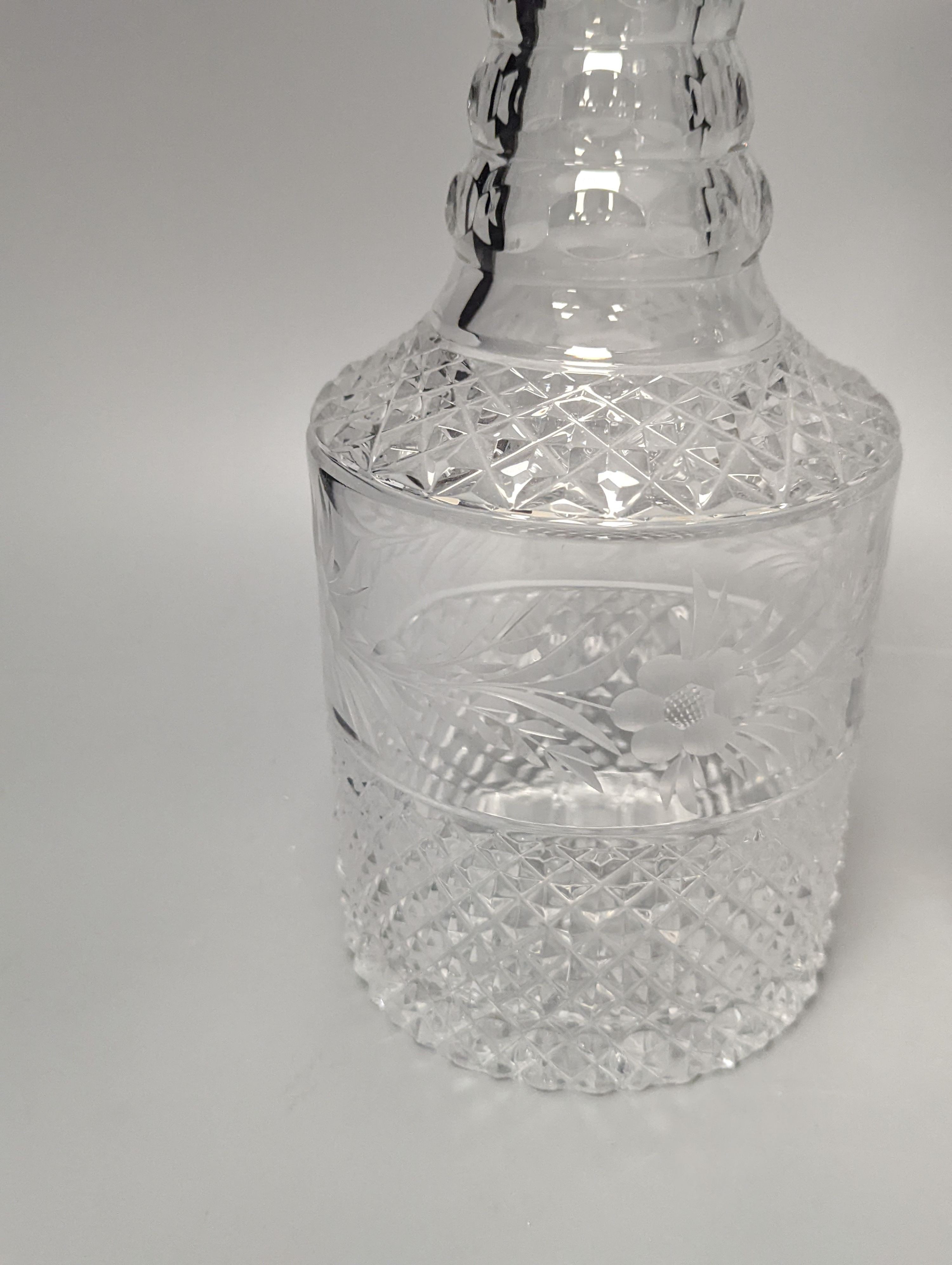 A pair of silver mounted glass decanters, with stoppers, height 28cm
